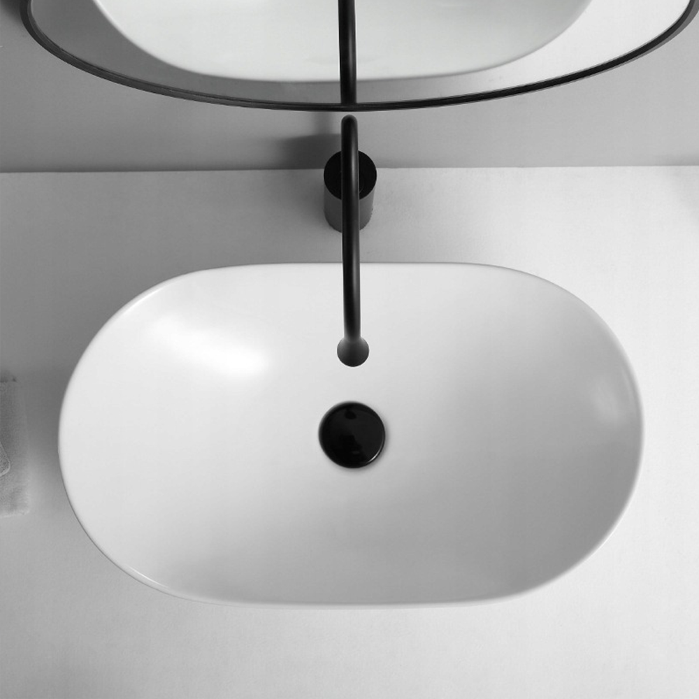 Owalna umywalka z białej, błyszczącej ceramiki do łazienki, 60,5×36×15 cm