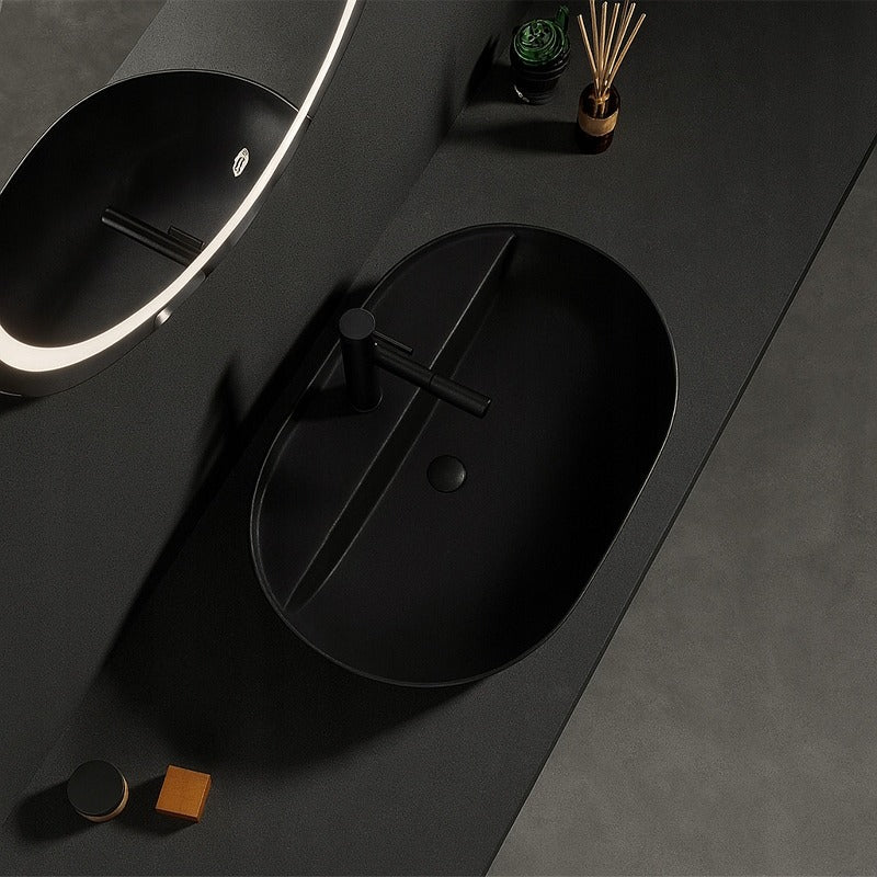 Owalna umywalka z czarnej ceramiki z otworami, 60 cm